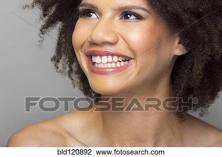 Stock Image - Mixed race woman smiling. Fotosearch