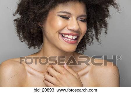 Stock Image - Mixed race woman smiling. Fotosearch