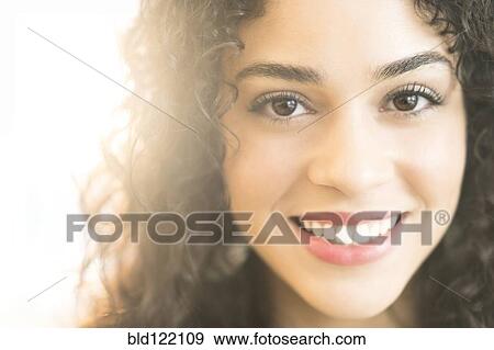 Stock Photo - Mixed race woman smiling. Fotosearch