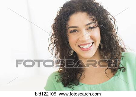 Stock Photography - Mixed race woman smiling. Fotosearch