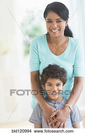 Picture - Mother and son hugging. Fotosearch