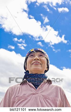 Older Japanese woman smiling outdoors View Large Photo Image Stock Image - Older Japanese woman smiling outdoors. Fotosearch