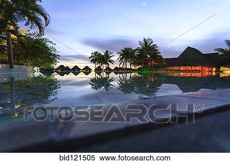 Stock Photography - Palm trees and tropical resort, Bora Bora, French Polynesia. Fotosearch