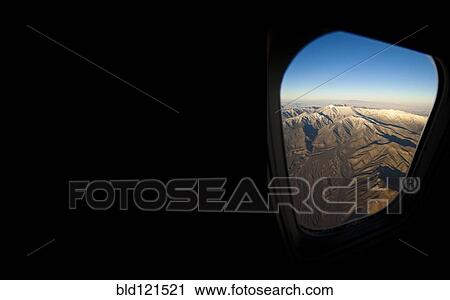 Rocky landscape viewed from airplane window View Large Photo Image Stock Image - Rocky landscape viewed from airplane window. Fotosearch