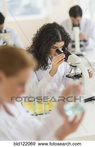 Scientist using microscope in laboratory View Large Photo Image Stock Photo - Scientist using microscope in laboratory. Fotosearch