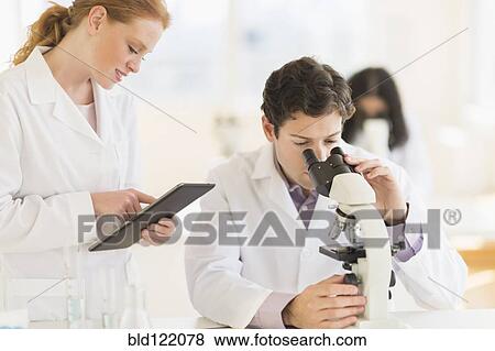 Stock Photo - Scientists working in laboratory. Fotosearch