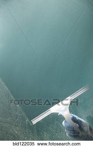 Squeegee cleaning dirty window View Large Photo Image Stock Photography - Squeegee cleaning dirty window. Fotosearch