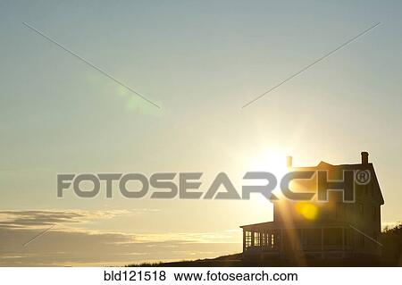 Sun shining behind rural house View Large Photo Image Stock Photo - Sun shining behind rural house. Fotosearch