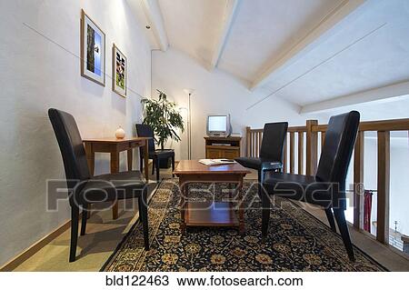 Table and chairs in loft area View Large Photo Image Stock Image - Table and chairs in loft area. Fotosearch