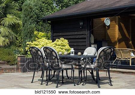 Table and chairs on back porch View Large Photo Image Stock Image - Table and chairs on back porch. Fotosearch