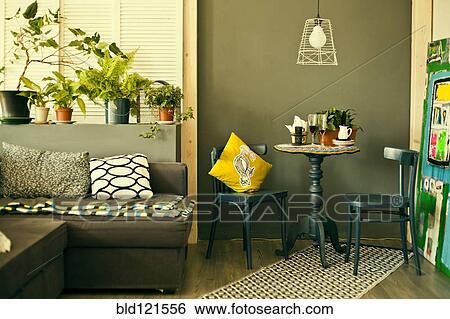Table, chairs and sofa in modern living room View Large Photo Image Stock Photograph - Table, chairs and sofa in modern living room. Fotosearch