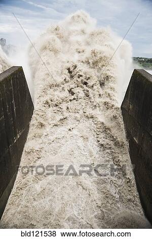 Water crashing through spout View Large Photo Image Stock Photo - Water crashing through spout. Fotosearch