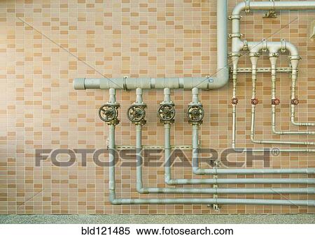 Water pipes on brick wall View Large Photo Image Stock Photography - Water pipes on brick wall. Fotosearch