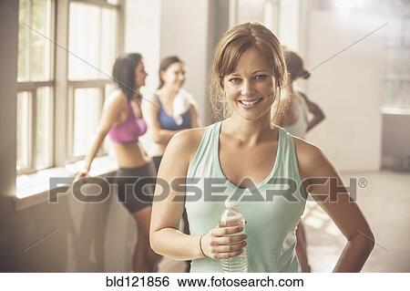 Stock Photograph - Woman smiling in gym. Fotosearch