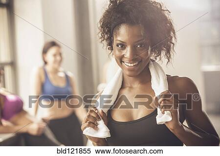 Stock Photography - Woman smiling in gym. Fotosearch