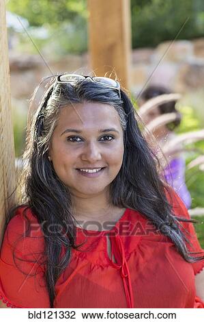 Woman smiling outdoors View Large Photo Image Stock Image - Woman smiling outdoors. Fotosearch