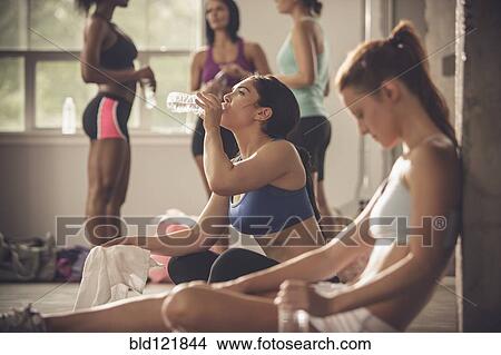 Picture - Women resting in gym. Fotosearch