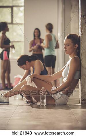 Women resting in gym View Large Photo Image Stock Image - Women resting in gym. Fotosearch