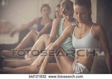Women stretching in gym View Large Photo Image Stock Image - Women stretching in gym. Fotosearch
