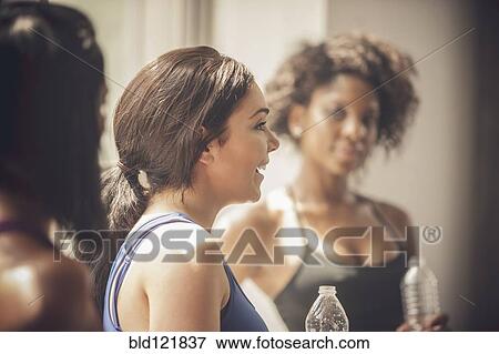 Stock Photo - Women talking in gym. Fotosearch