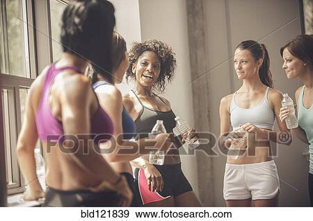 Stock Photo - Women talking in gym. Fotosearch