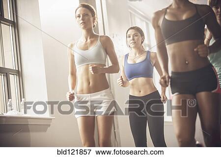 Women working out in exercise class View Large Photo Image Stock Photo - Women working out in exercise class. Fotosearch