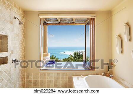 Bathroom window overlooking infinity pool and ocean View Large Photo Image Picture - Bathroom window overlooking infinity pool and ocean. Fotosearch
