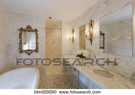 Bathtub and mirrors in ornate bathroom View Large Photo Image Stock Image - Bathtub and mirrors in ornate bathroom. Fotosearch