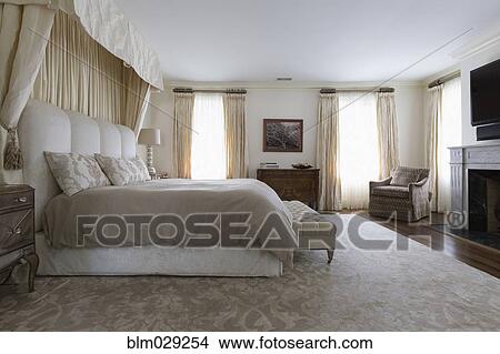 Bench and bed in ornate bedroom View Large Photo Image Picture - Bench and bed in ornate bedroom. Fotosearch