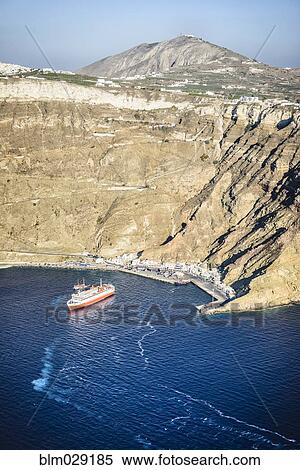 Stock Photography - Boat moored in harbor, Ormos Athinios, Egeo, Greece. Fotosearch