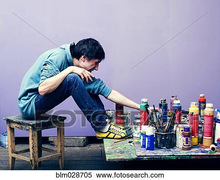 Caucasian artist examining paints View Large Photo Image Stock Photography - Caucasian artist examining paints. Fotosearch
