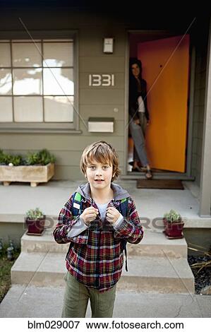 Stock Photo - Caucasian boy leaving for school. Fotosearch