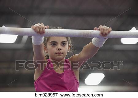 Caucasian gymnast practicing on bar View Large Photo Image Stock Photo - Caucasian gymnast practicing on bar. Fotosearch