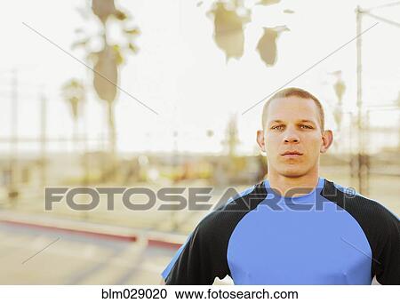 Stock Image - Caucasian man in sportswear outdoors. Fotosearch