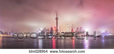 City skyline lit up at night, Shanghai, China View Large Photo Image Picture - City skyline lit up at night, Shanghai, China. Fotosearch