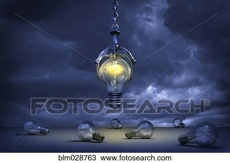 Stock Image - Claw grabbing illuminated light bulb. Fotosearch
