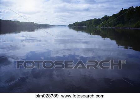 Clouds reflected in still lake, Albany, New York, United States View Large Photo Image Stock Photo - Clouds reflected in still lake, Albany, New York, United States. Fotosearch