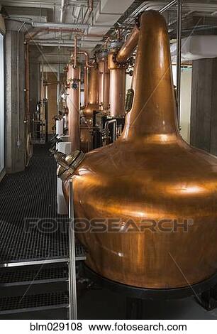 Stock Photo - Copper stills in factory. Fotosearch