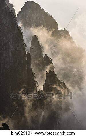 Fog rolling over mountains, Huangshan, Anhui, China, View Large Photo Image Stock Photo - Fog rolling over mountains, Huangshan, Anhui, China, . Fotosearch