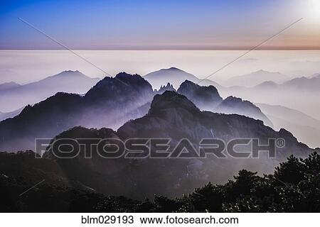 Fog rolling over rocky mountains, Huangshan, Anhui, China View Large Photo Image Stock Image - Fog rolling over rocky mountains, Huangshan, Anhui, China. Fotosearch