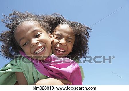 Girls playing together outdoors View Large Photo Image Stock Photo - Girls playing together outdoors. Fotosearch