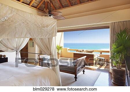 Luxury bedroom with ocean view View Large Photo Image Stock Photo - Luxury bedroom with ocean view. Fotosearch