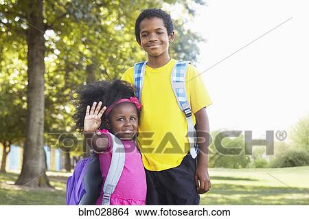 Picture - Mixed race children smiling together. Fotosearch