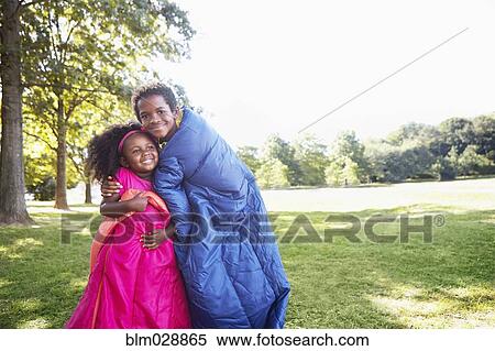 Mixed race children wrapped in sleeping bags View Large Photo Image Stock Photography - Mixed race children wrapped in sleeping bags. Fotosearch