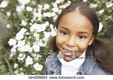 Mixed race girl smiling outdoors View Large Photo Image Picture - Mixed race girl smiling outdoors. Fotosearch