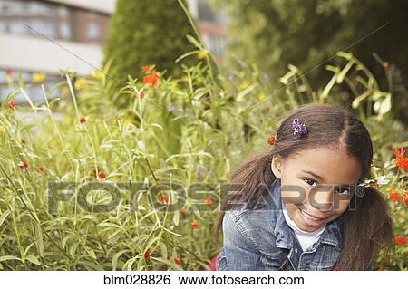 Mixed race girl wearing flowers in her hair View Large Photo Image Stock Photograph - Mixed race girl wearing flowers in her hair. Fotosearch