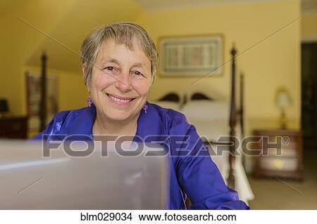 Picture - Senior Caucasian woman using laptop. Fotosearch