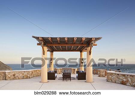 Thatched roof patio overlooking ocean, Cabo San Lucas, BCS, Mexico View Large Photo Image Stock Photo - Thatched roof patio overlooking ocean, Cabo San Lucas, BCS, Mexico. Fotosearch