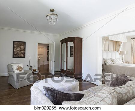 Wardrobe and sofa in ornate bedroom View Large Photo Image Stock Photography - Wardrobe and sofa in ornate bedroom. Fotosearch
