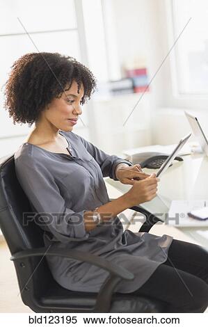 African American businesswoman using digital tablet View Large Photo Image Stock Photography - African American businesswoman using digital tablet. Fotosearch
